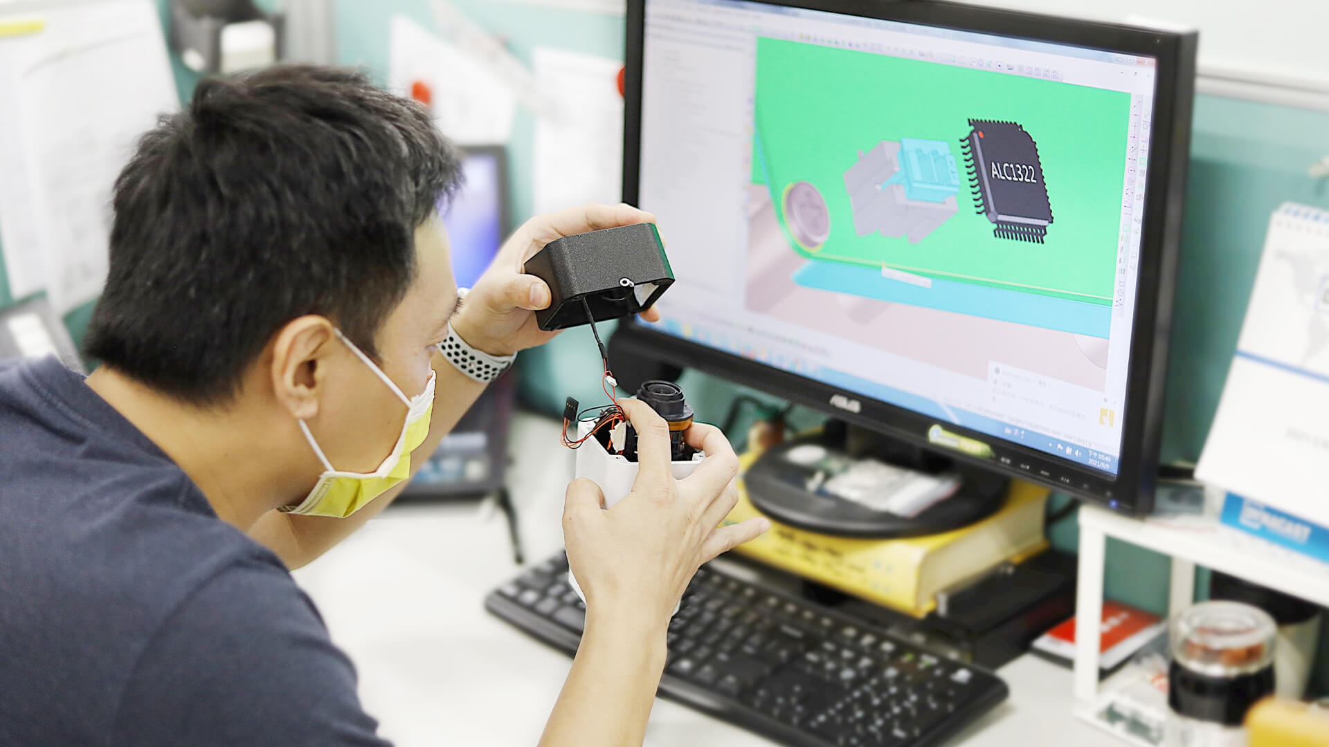 Engineer inspecting a product to verify design details, illustrating the Design Quality Assurance (DQA) process